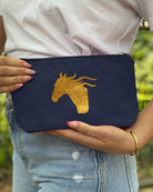 Navy canvas makeup bag with metallic gold foil horseshoe and Ride Jump Repeat equestrian design