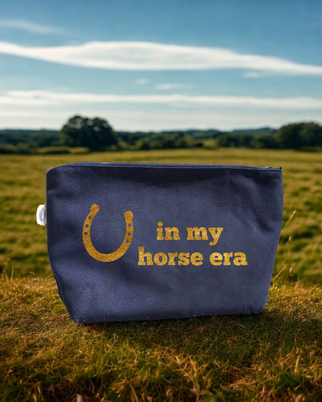 Navy canvas makeup bag with metallic gold foil horseshoe and In My Horse Era design