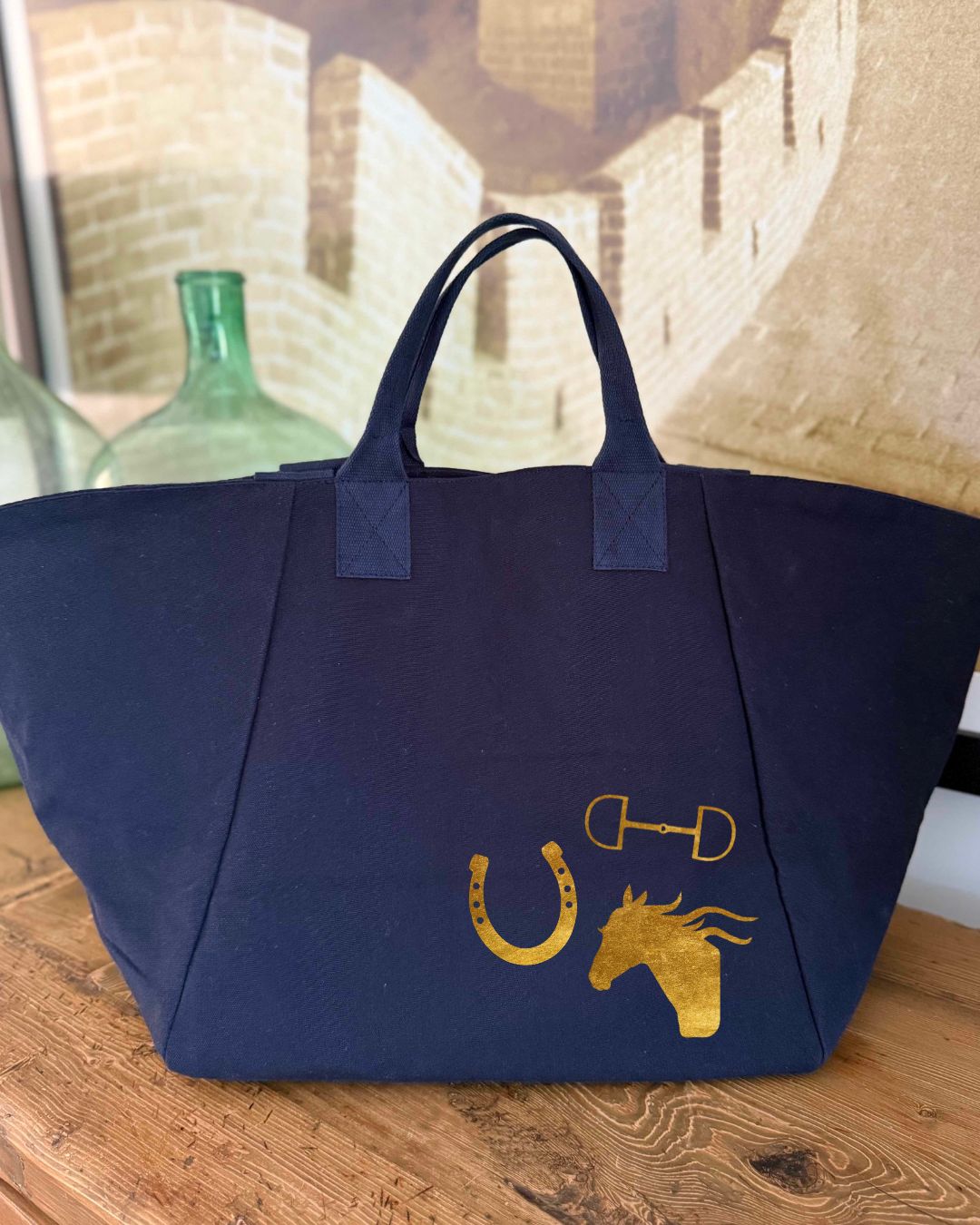 Navy Chelsea Bag with metallic gold foil horse bit, horseshoe, and horse head equestrian icons